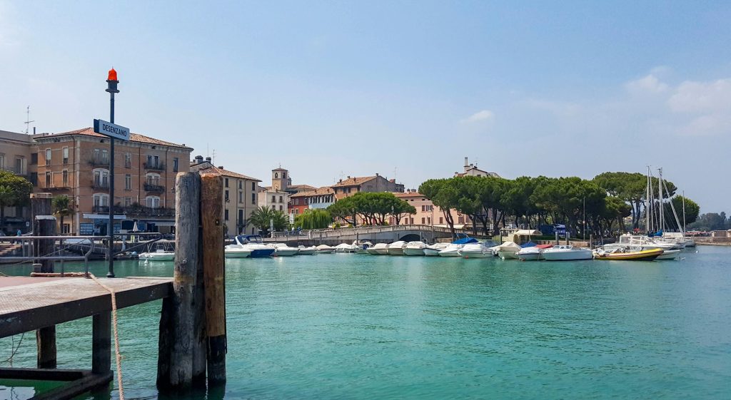 Cityscape of coastal town on lake. Desenzano del Garda.   - The best places of Lake Garda - Exclusive Travel Representation - Luxury travel agency that represent tourism companies that offer unique and exclusive experiences