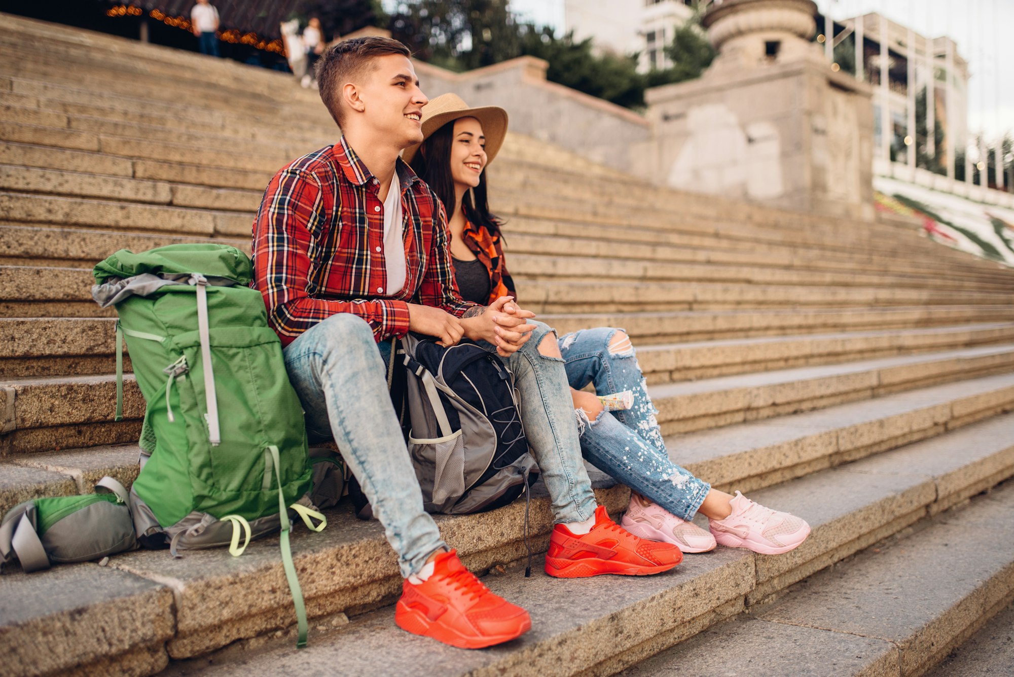 Tourists resting on the steps of ancient temple - Discover Asia's 3 most impressive temples - Exclusive Travel Representation, luxury travel agency.