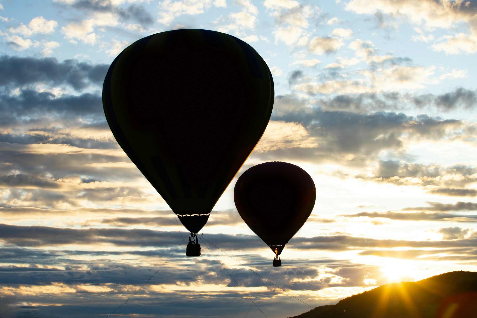 Hot air balloon over blue sky.