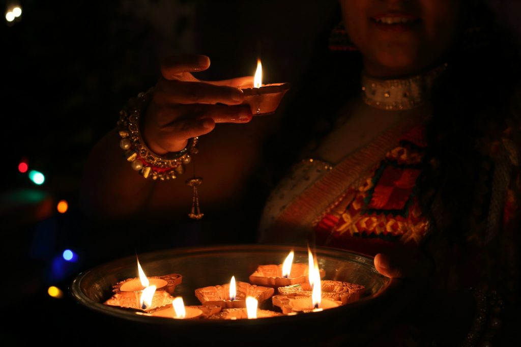 Woman with lamps, in celebration of Diwali