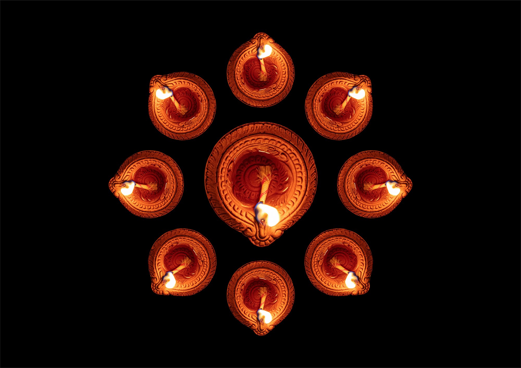 Happy Diwali. Diya oil lamps against dark background,